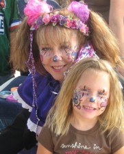 Penelope The Clown poses, after face painting a little girl who wanted to look 'just like Penelope'